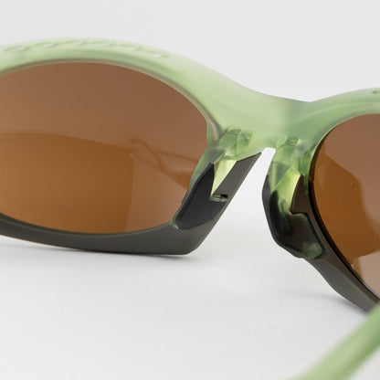 Occhiale da sole Oakley Plantaris OO9437 0363 Olive - Clyra Eyewear